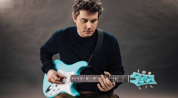 John Mayer playing guitar